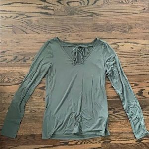 green long sleeve shirt with a tie on the front